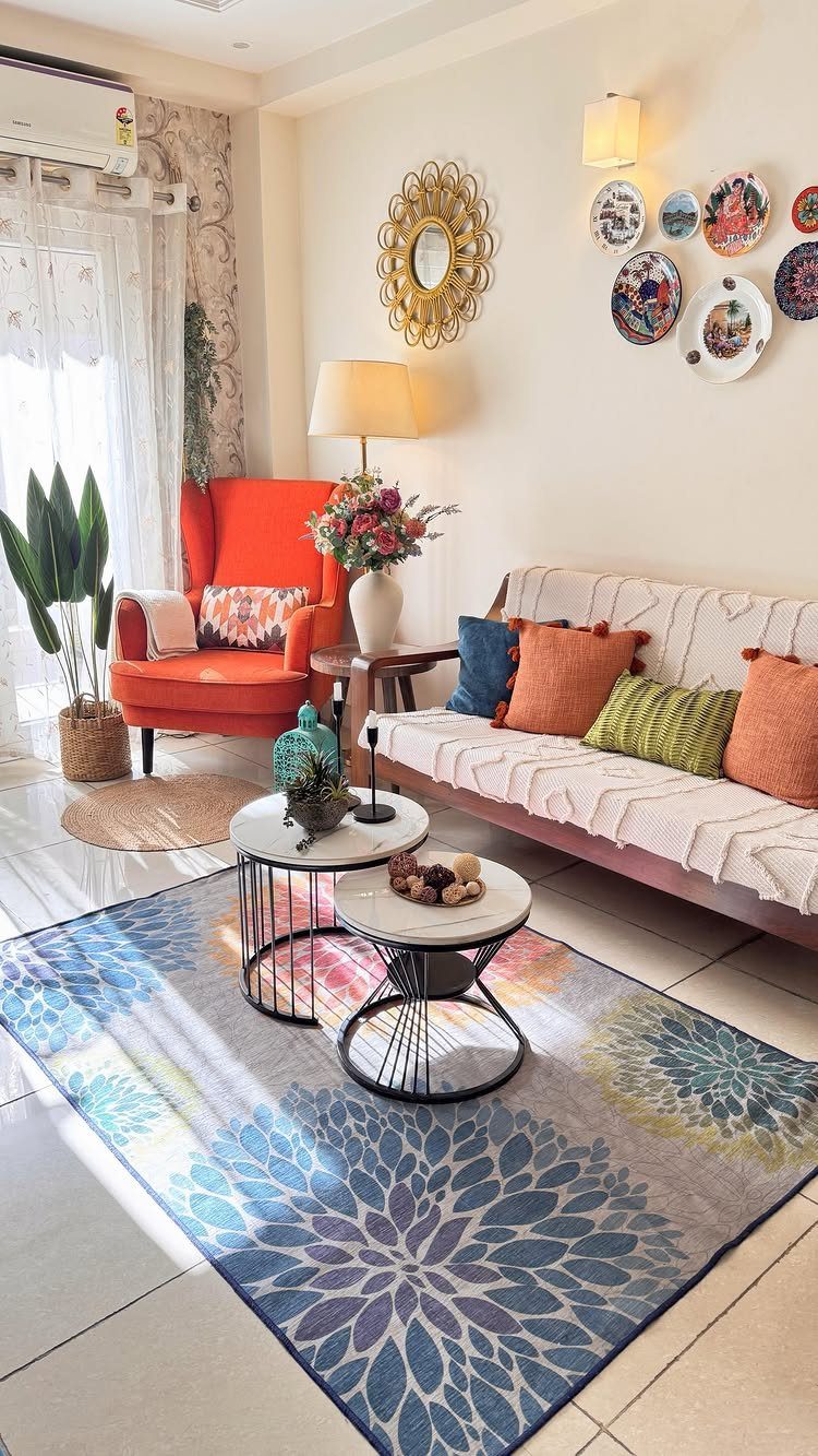 15 Apartment Decor Inspiration Ideas for Small Living Spaces 10 Two round white marble nesting tables on a blue patterned rug in a living room