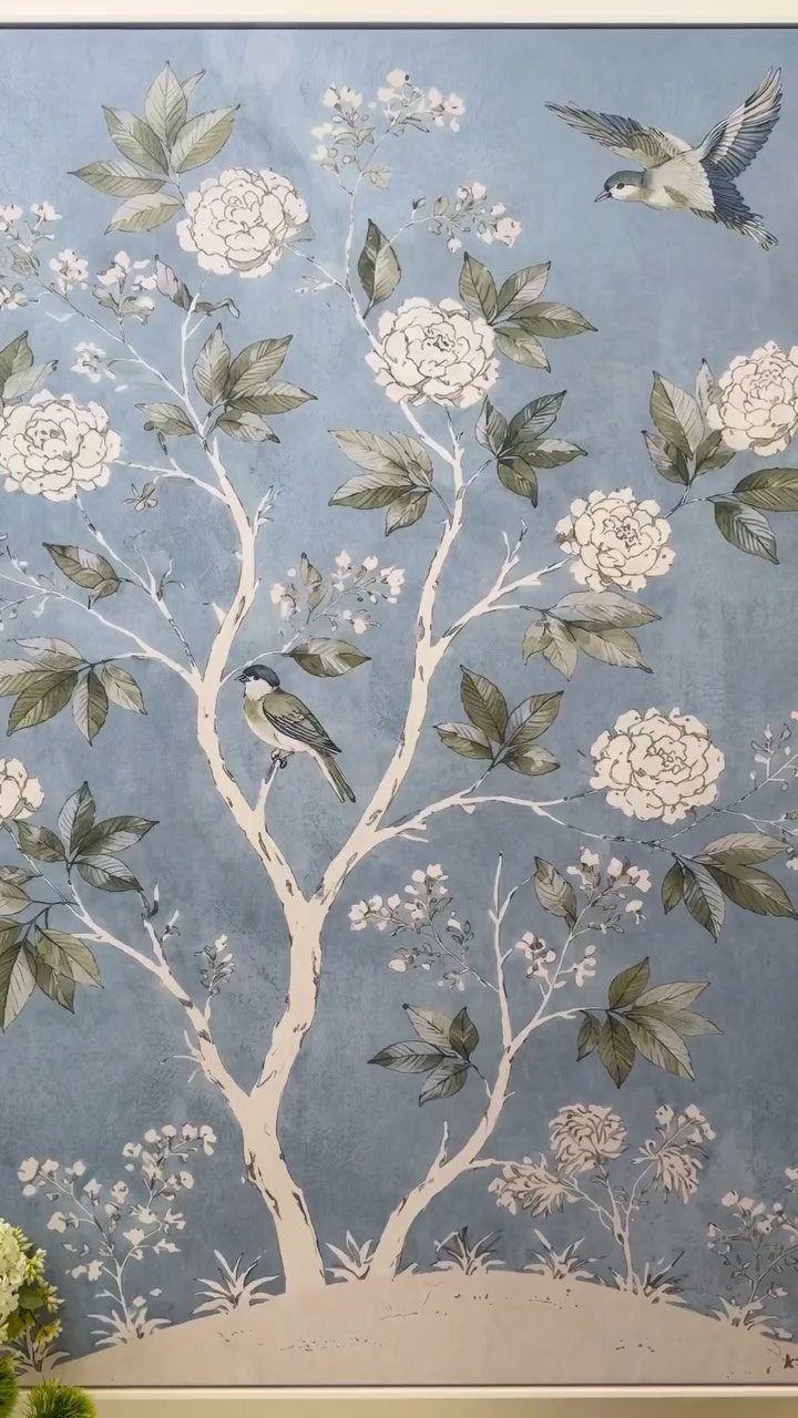 Chinoiserie-style print with white flowering branches and birds on a blue background.