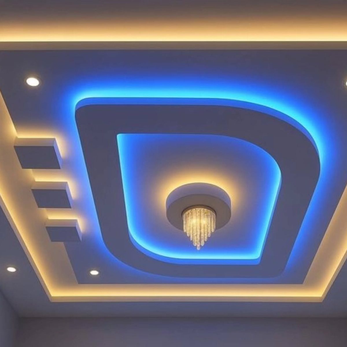 Multilevel gypsum ceiling with blue and yellow LED lighting and a crystal chandelier.