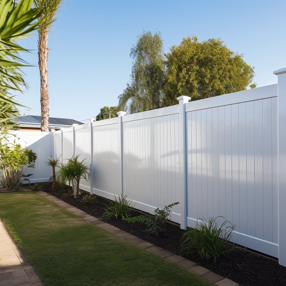 Fence Grill Design Modern: 28 Ideas from Steel to Aluminum 11 White PVC vinyl fence panels installed in a residential backyard with green grass.