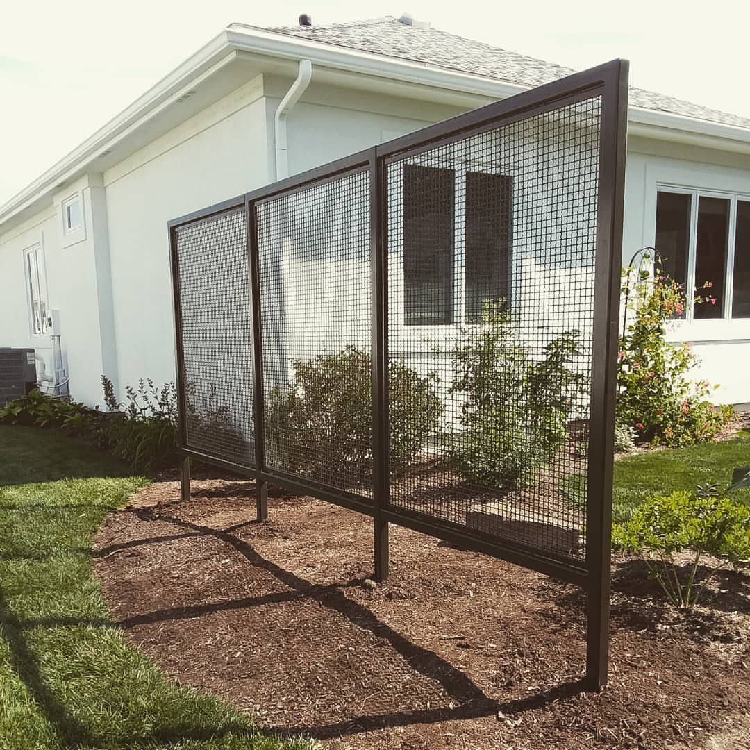 Fence Grill Design Modern: 28 Ideas from Steel to Aluminum 1 Steel welded wire mesh fence panels installed in a garden beside a white house.
