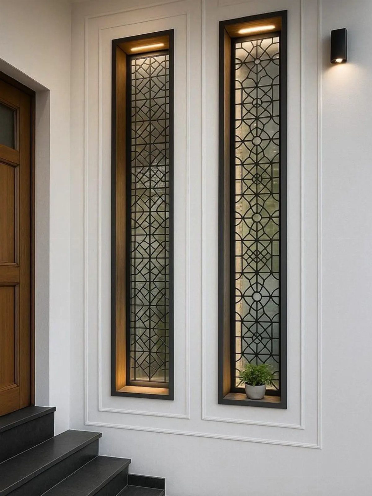 Black geometric diamond pattern window grills set in a white wall with molding.