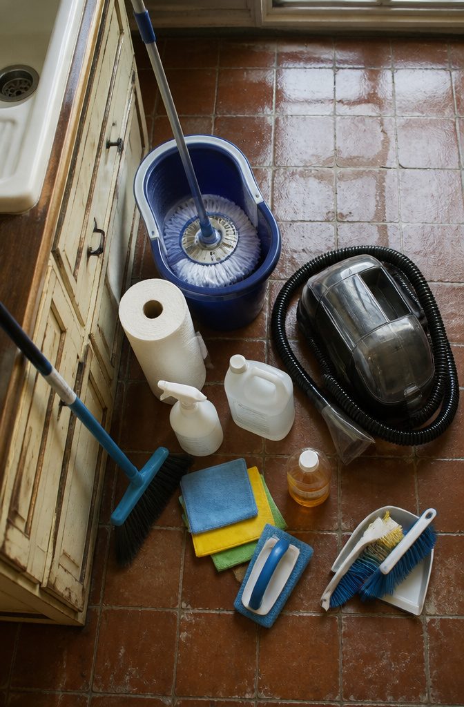 Home Cleaning and Organizing: A Practical Guide to a Tidy House 6 Household cleaning tools and products arranged for floors, sinks, and surfaces