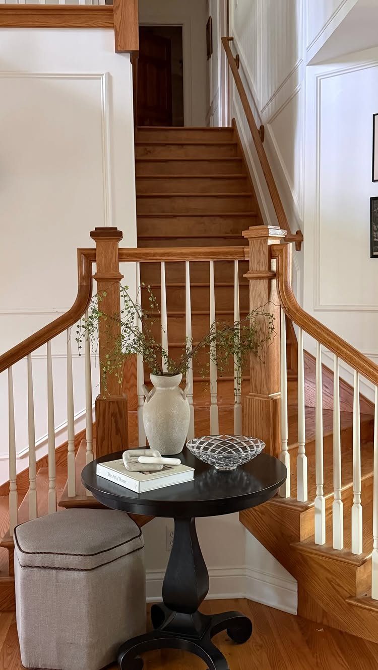 Honey Oak Wood Floors: 8 Design Ideas That Work 7 Honey oak wood stairs and flooring in a bright home interior with white walls.