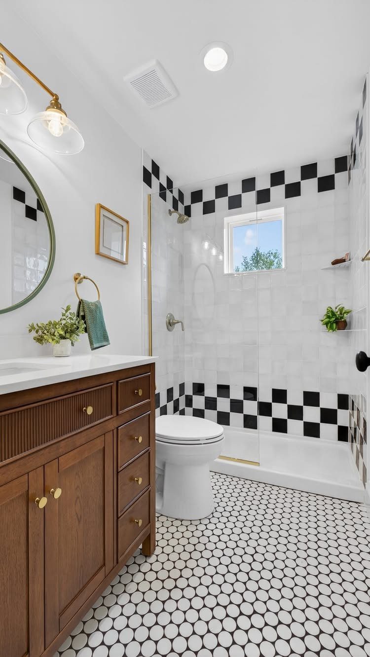 10 Modern Farmhouse Flooring Ideas for Every Room 10 Black and white penny tile flooring in a modern bathroom with a wooden vanity.