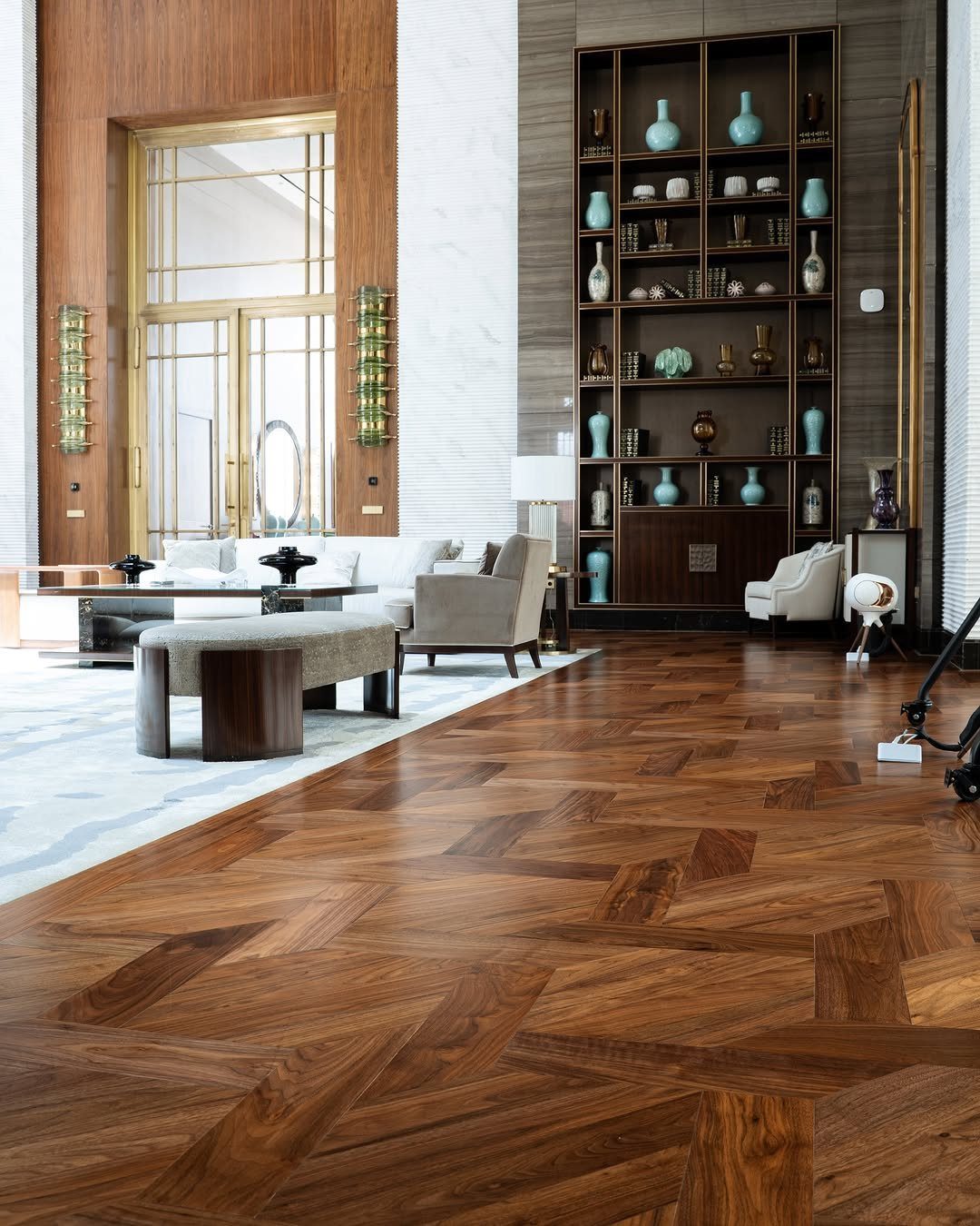 Parquet Floor Pattern: 8 Historic Layouts That Still Define Interiors 7 Polished dark wood parquet floor with a geometric pattern in a luxurious living room setting.