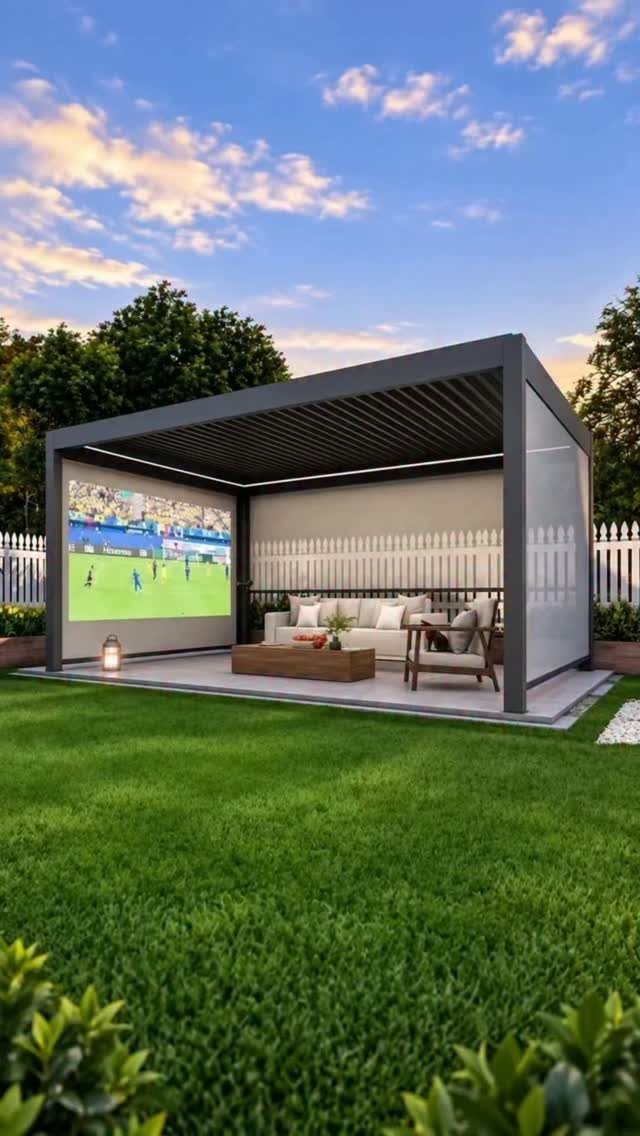 25 Patio Lights Ideas, From String Lights to Step Lighting 23 Modern grey patio pergola with outdoor movie screen and lounge furniture on green grass.