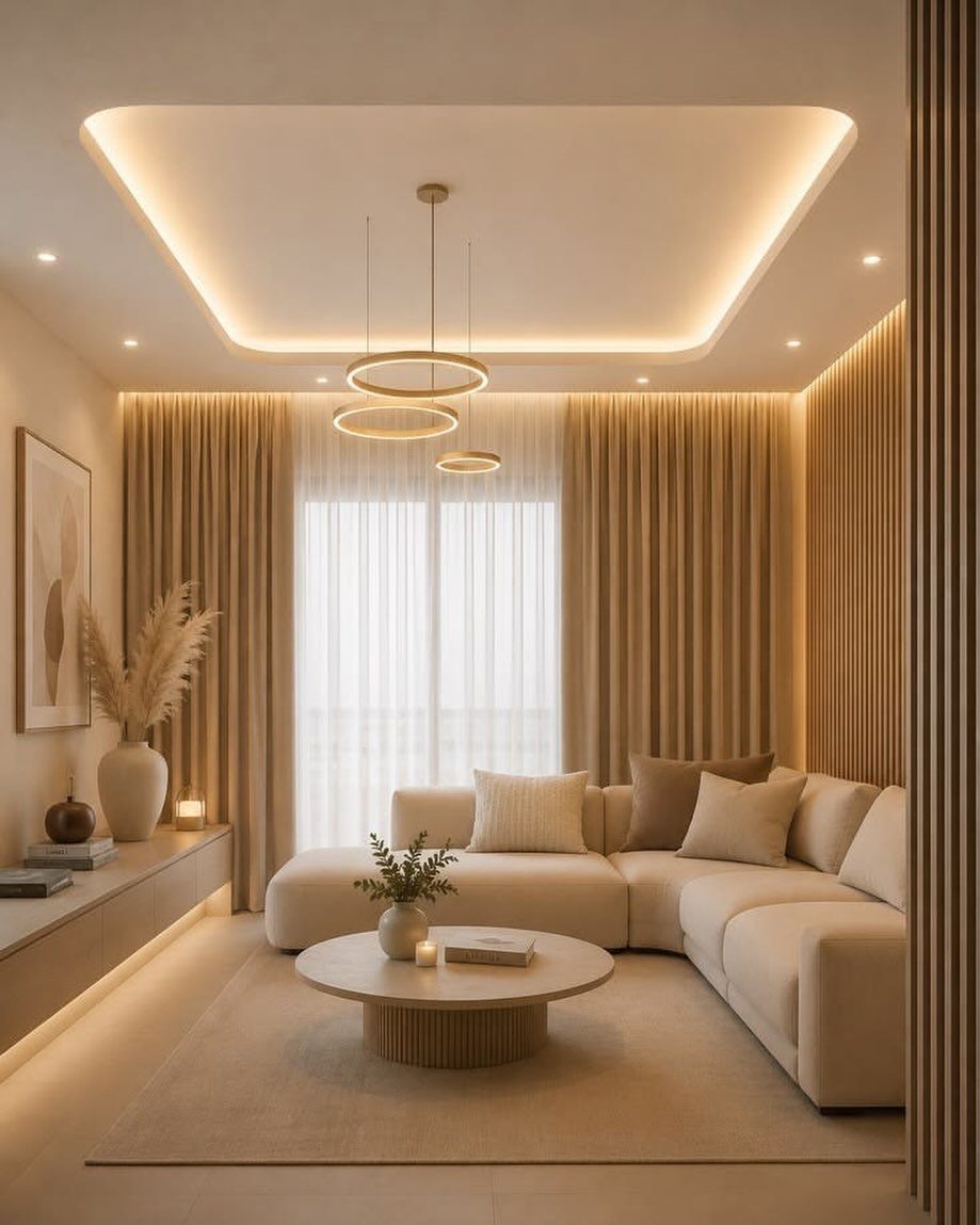 Modern living room with a white tray ceiling and warm recessed lighting.