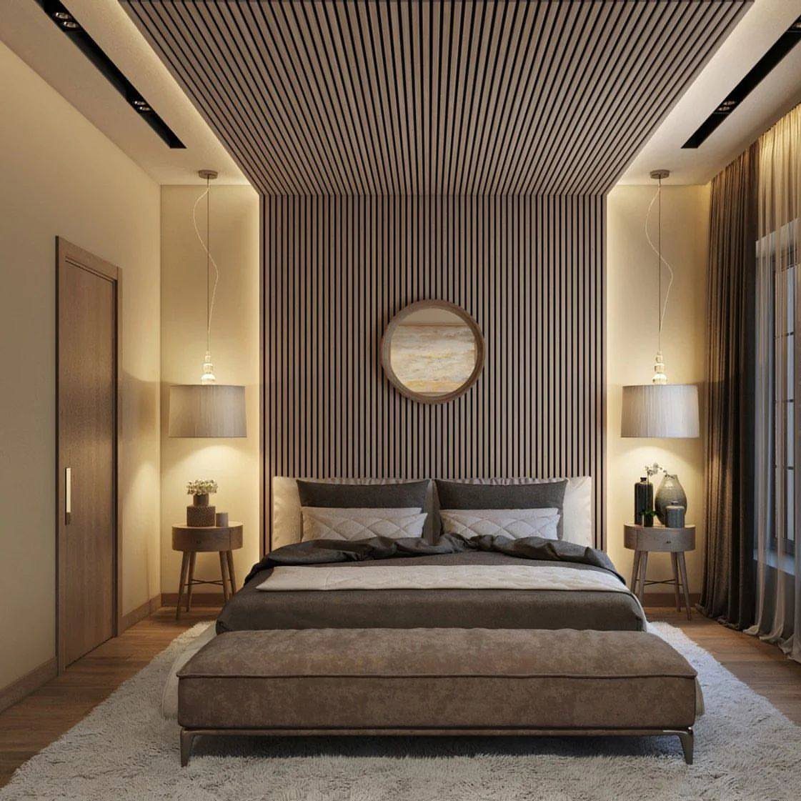 Vertical wood slats covering a bedroom accent wall and extending onto the ceiling.