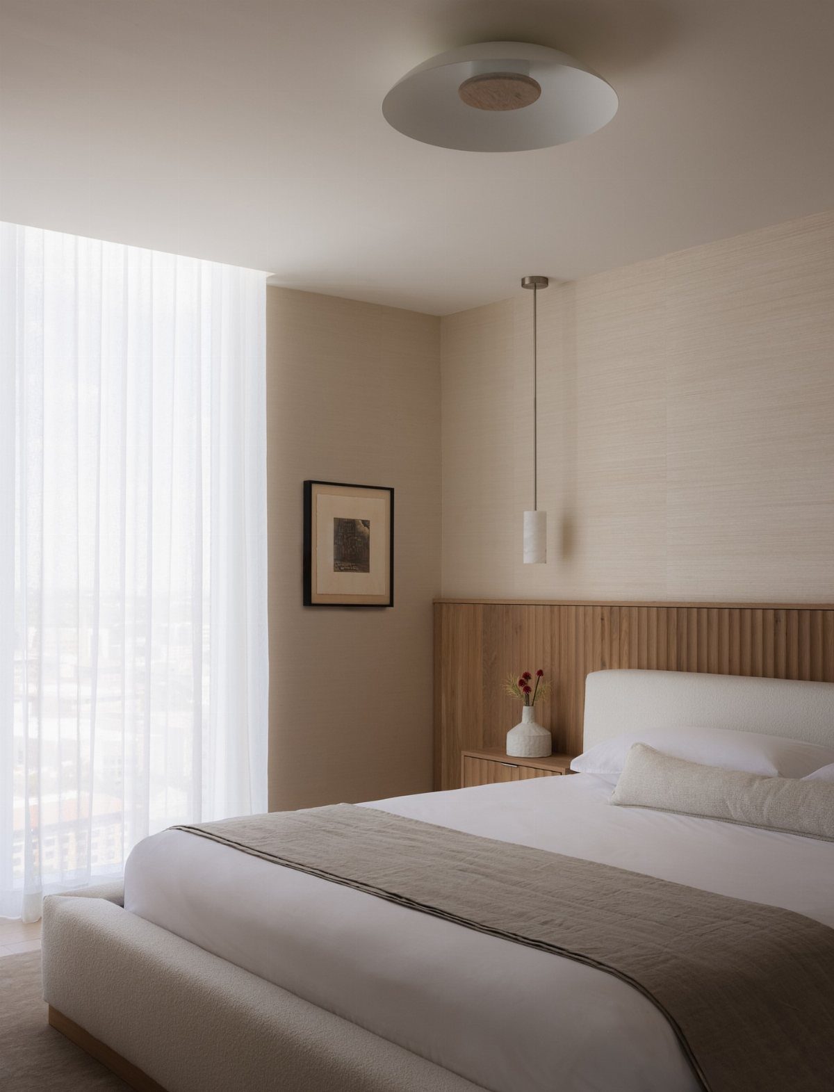 Wall Texture Design: 12 Ideas for Every Room 12 A modern bedroom with a bed and grasscloth textured wallpaper on the wall.