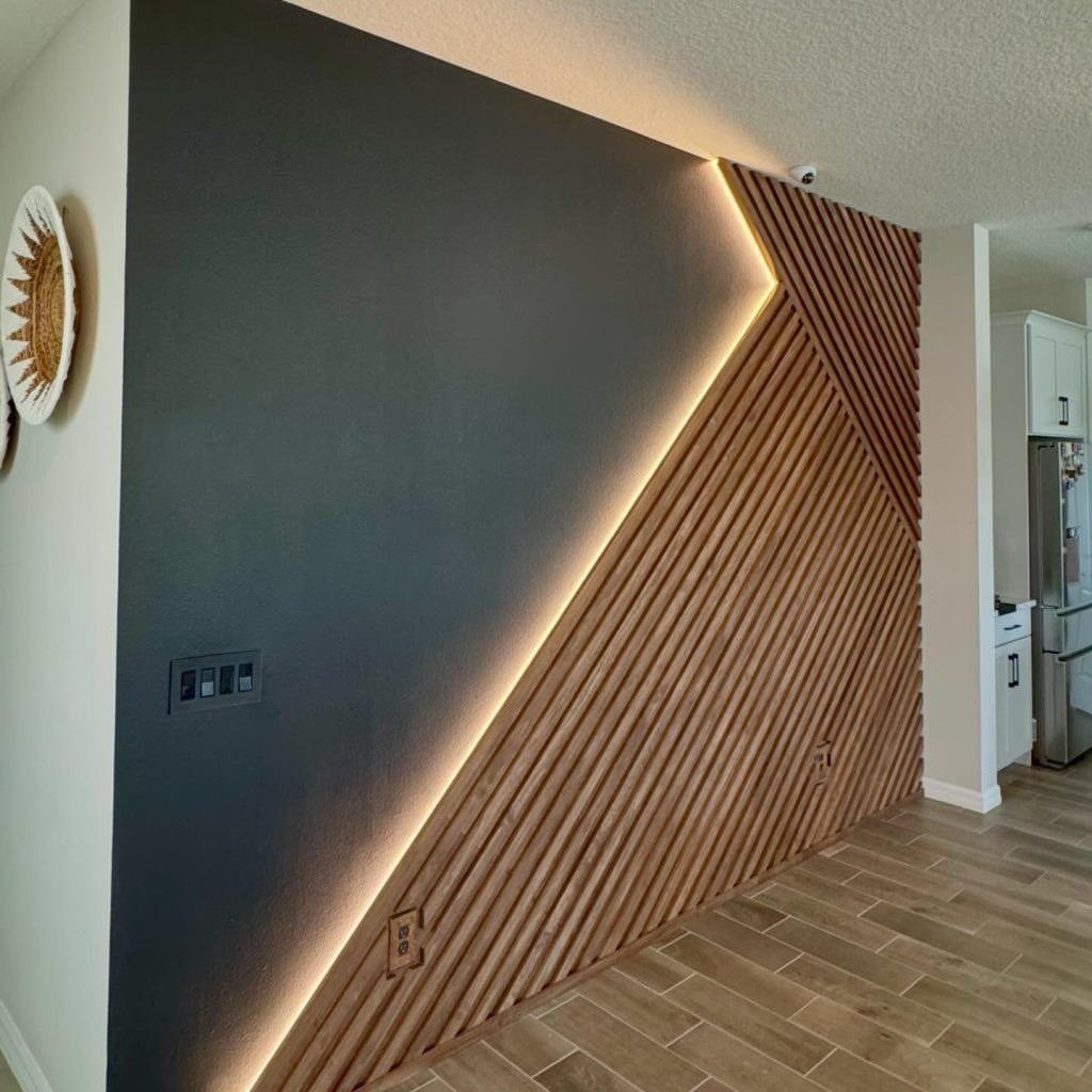 10 Wood Wall Ideas Living Room Spaces Need Now 10 Vertical wood slats with integrated LED backlighting creating a geometric pattern on a dark wall.